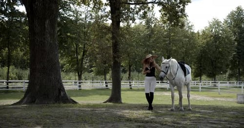 Woman and Horse Walk on Ranch