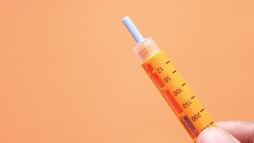 Hand Holding Insulin Pens with Copy Space, Top Down