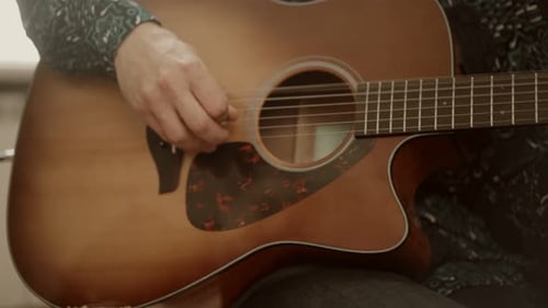 Acoustic Guitar Strumming Close Up