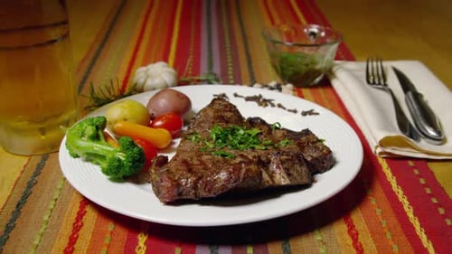 Steak Dinner with Potatoes and Vegetables on Table
