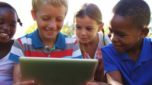 Group of kids using digital tablet