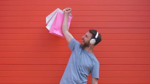 Excited Man Celebrates Shopping with Music