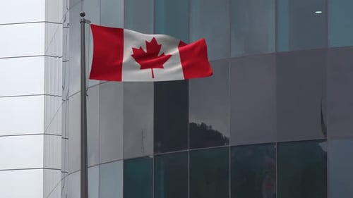 Canadian Flag Waving on Flagpole