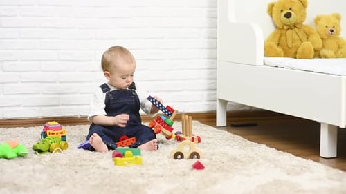 Infant Playing with Toys on a Cozy Rug