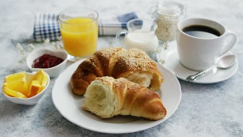 Breakfast Still Life with Coffee, Croissant, and Juice