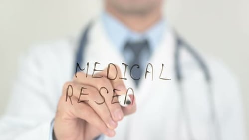 Doctor Writes Medical Research on Clear Surface