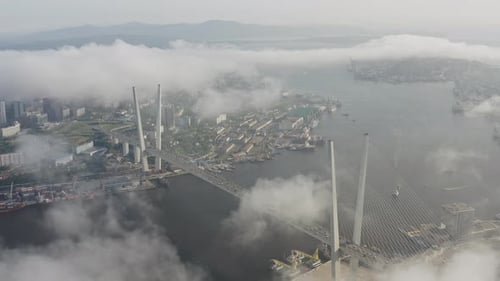 Drone View of the Golden Bridge in the Fog and the City at Sunset