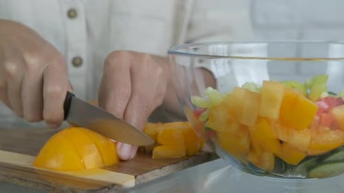 Woman Preparing Fresh Salad at Home