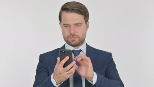 Man in Suit Using Smartphone
