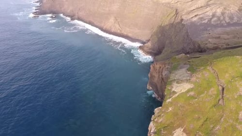 Rocky coastline, the sight of a collapsed vulcano.