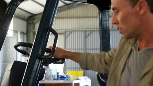 Portrait of happy worker standing near forklift 4k