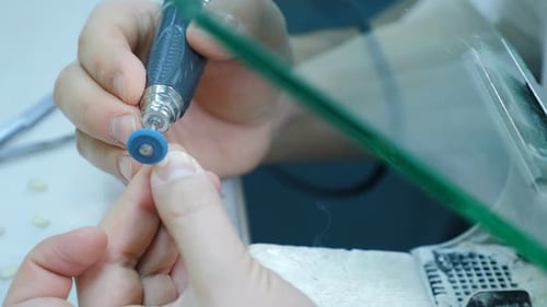 Dental Technician Making a Crown