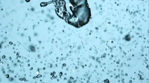 Clear Water Pouring and Splashing in a Close-Up