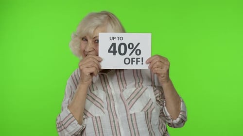 Senior Grandmother Showing Sale 40 Percent Off Banner Advertisement. Online Shopping. Black Friday