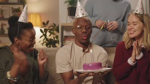 Friends Celebrating Birthday Together Indoors