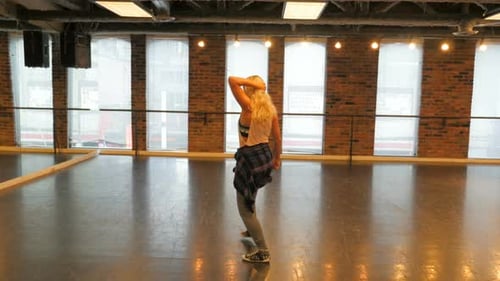 Woman Dancing in an Open Studio Space