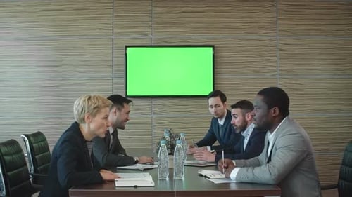 Diverse Team Meeting at Conference Table