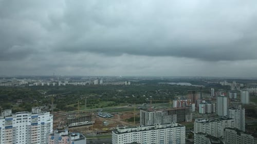 Flight over the city block in cloudy weather.