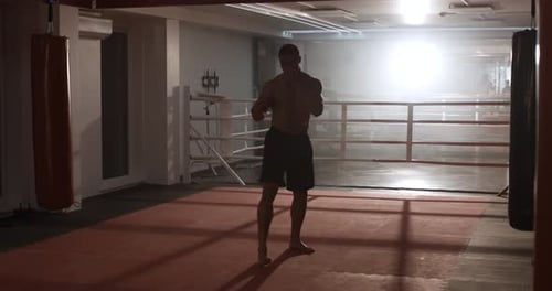 Boxing, Athletic Man Fighter Trains His Punches and Beats, Training Day in the Boxing Gym.