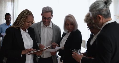 Multiracial business people working inside modern bank office