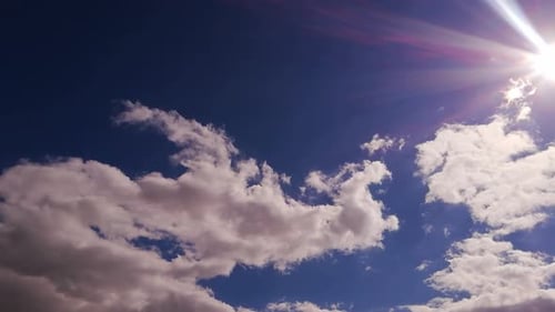 Clouds Floating in Blue Sky on Sunny Day