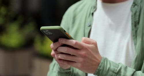 Man Using Mobile Phone in Urban Setting