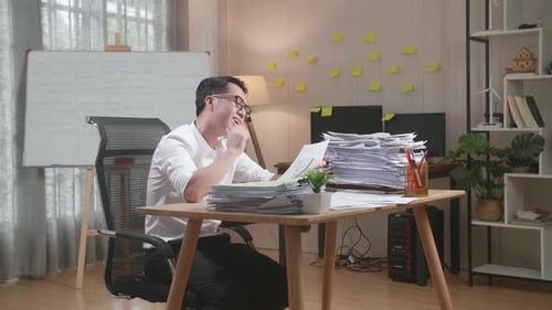 Adult reviewing paperwork in an office setting