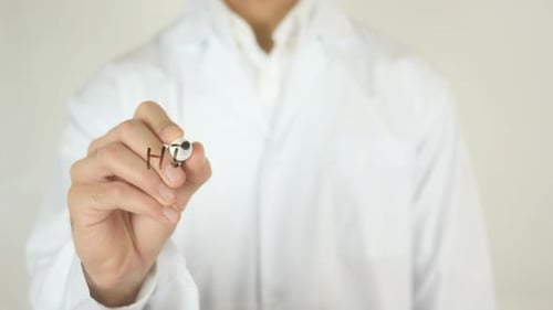 Doctor Writes "High Cholesterol" on Clear Surface