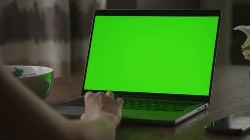 Close Up of a Caucasian Woman Hand Rest on a Laptop Computer Touchpad with Green Screen Chroma Key