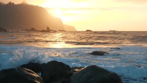 Slow Motion. Ocean Waves in Beautiful Sunset Light on Benijo Beach in Tenerife, Canary Islands. Big