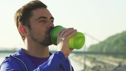 Man Drinking Water After Workout