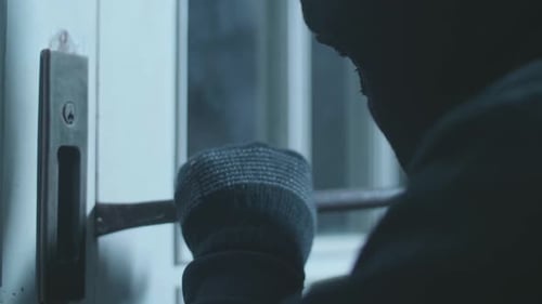 Close Up Of Thief Man Using Crowbar Open The Door Before Entering Someone's House
