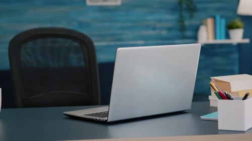 Close Up of Laptop Computer Placed on Modern Working Desk in Empty Home
