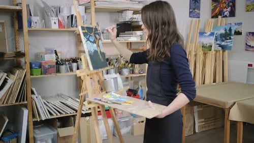 Woman Painting Abstract Landscape in Art Studio