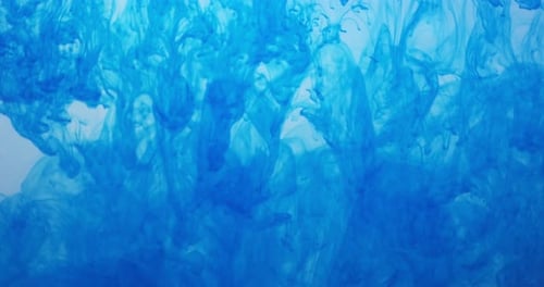 Abstract Blue Ink Swirling in Liquid