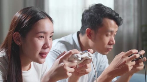 Young Adults playing video games at Home