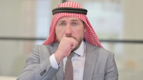 Arab Man Coughing Wearing Traditional Headdress And Suit