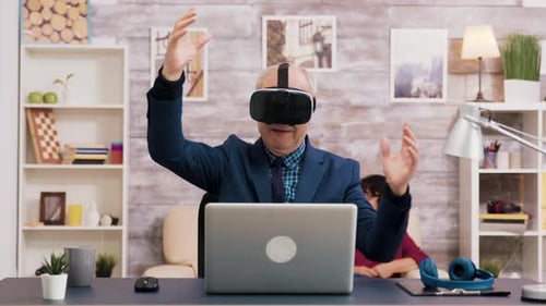 Man uses vr headset at desk