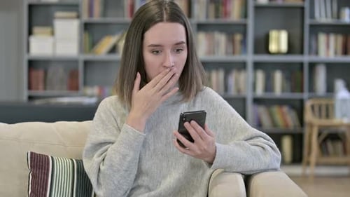 Woman Reacting to Something on Her Cellphone