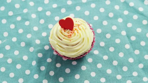 Cupcake against polka dot background