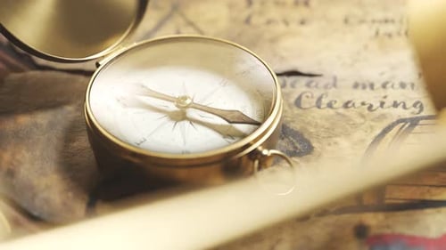 Vintage Compass and Magnifying Glass on Old Treasure Map