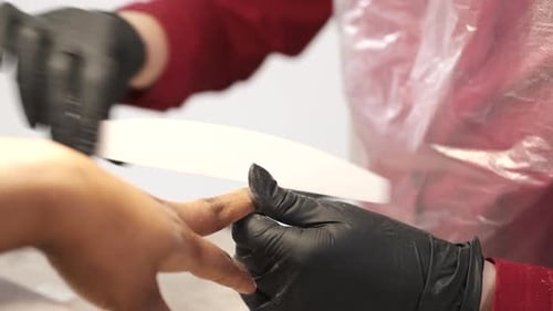 Manicurist Files Nails During Manicure Session Close Up