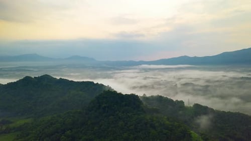 Beautiful Landscape in the morning time during sunrise with fog above the mountain,