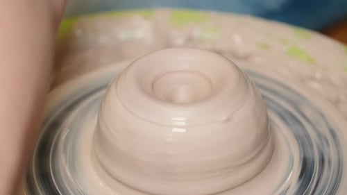Close Up of Female Potters Hands Making Bowl