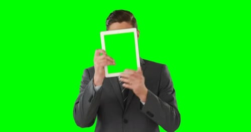 Man Using Tablet with Chroma Key Screen