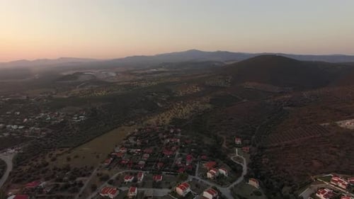 Aerial Scene of Cottages, Green Landscape with Hills and Plains in Greece