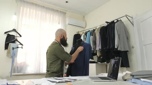Tailor draping a jacket