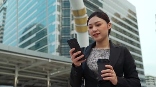 business woman using smartphone in the city
