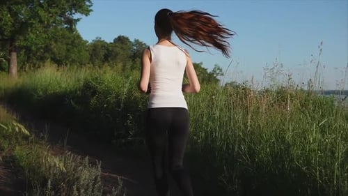 Woman Running on Rural Path, Healthy Lifestyle