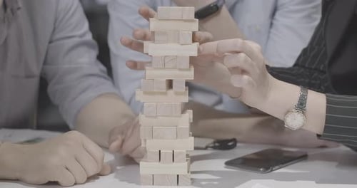 Group of Unrecognizable Millennial Caucasian Friends Playing Jenga